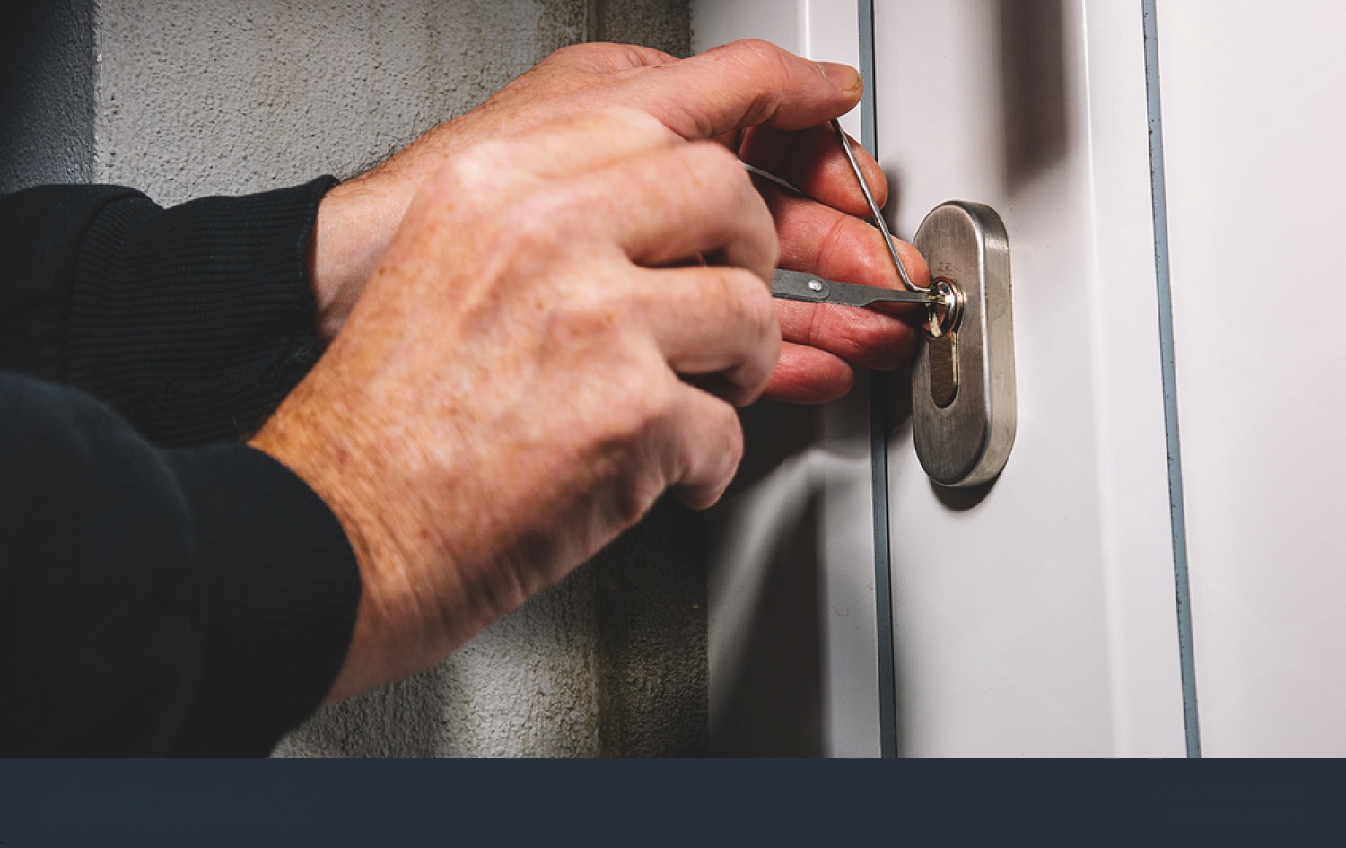 Locksmith fitting a deadlock and window locks at a Melbourne home